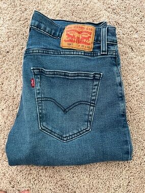 Levi's Men's Slim Straight Jeans in Medium Blue Denim